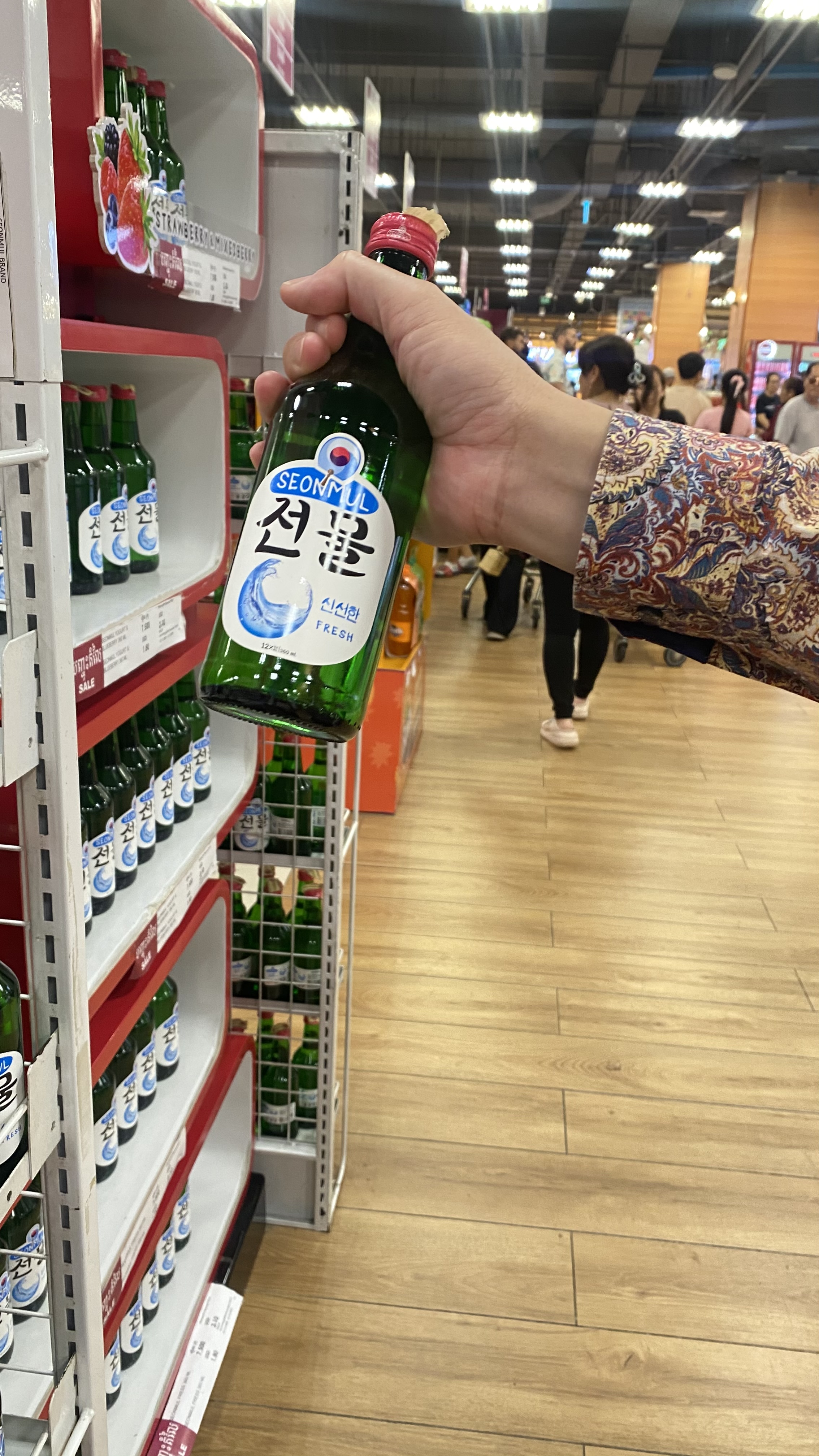 Customers enjoying Seonmul wine variety at AEON Mall 1